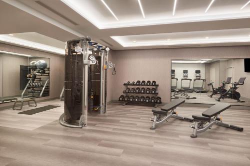 a fitness room with a gym with exercise equipment at Courtyard by Marriott Kitchener in Kitchener