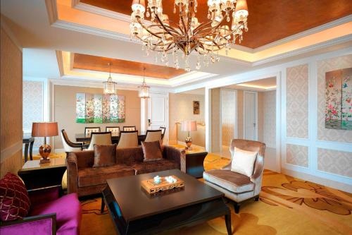 a living room with a couch and a table at Sheraton Shantou Hotel in Shantou