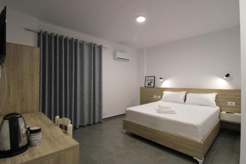 Ένα ή περισσότερα κρεβάτια σε δωμάτιο στο Hotel Villa Adrian