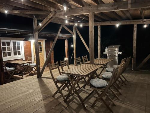 a wooden table and chairs on a wooden deck at Jyuuraku no mori - Vacation STAY 50432v in Awara