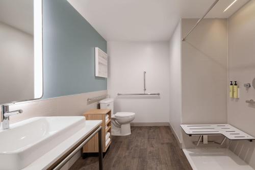 a white bathroom with a sink and a toilet at Element Salt Lake City Downtown in Salt Lake City