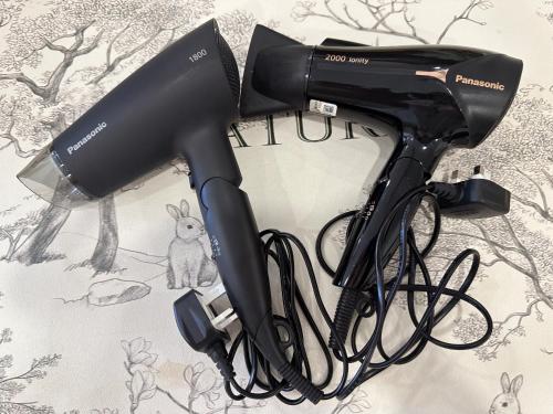 a black hair dryer sitting on a table at Opposite Legoland 5mins Medini DPristine 8 to 10pax in Nusajaya