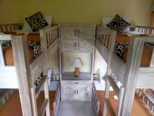 Una cama o camas en una habitación de Alam Pracetha Bali Ubud