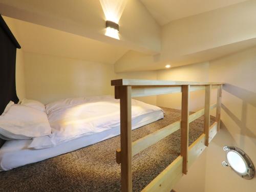 Una cama o camas en una habitación de Kurobe Sunvalley Hotel