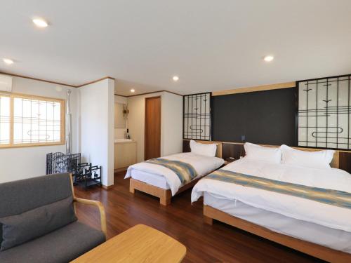 Una cama o camas en una habitación de Kurobe Sunvalley Hotel