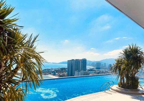 a swimming pool with a view of the city at A sea view beautiful studio apartment in Nha Trang