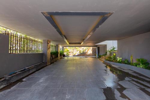 an empty hallway of a building with a ceiling at Cosa villages in Vung Tau