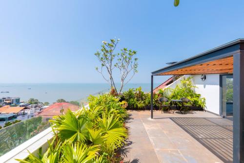 a house with a balcony with a view of the ocean at Cosa villages in Vung Tau
