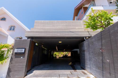 a gate leading into a tunnel between two buildings at Cosa villages in Vung Tau