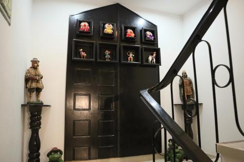 a room with a door with figurines in it at Cusco Bed and Breakfast in Cusco