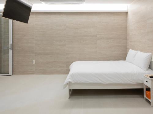 Ένα ή περισσότερα κρεβάτια σε δωμάτιο στο White Castle Pension