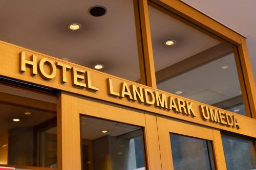 a sign on the door of a hotel landmannanarkavascript at Hotel Landmark Umeda in Osaka