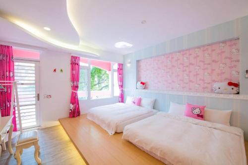 Un pat sau paturi într-o cameră la Qing Noise Villas