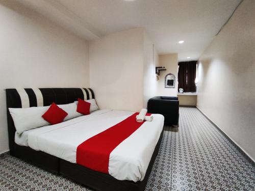 En eller flere senger på et rom på Ar Rayyan Hotel