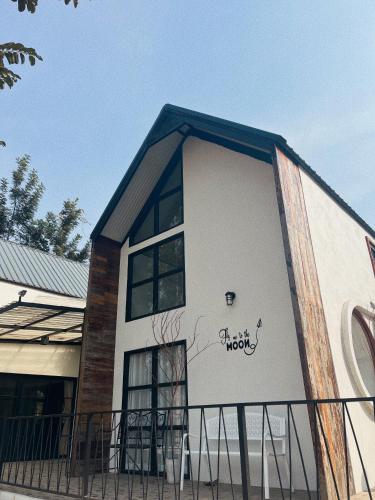 a building with graffiti on the side of it at Blessing Moon Pool Villa Khaoyai in Ban Tha Wua Tai