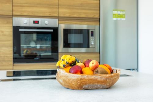 a bowl of fruit on a counter in a kitchen at Sestel in Capdepera