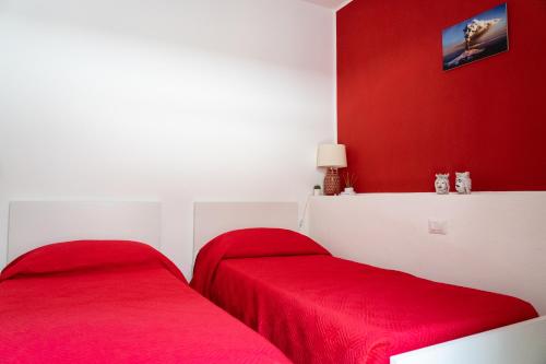 Ένα ή περισσότερα κρεβάτια σε δωμάτιο στο Portosalvo Rooms