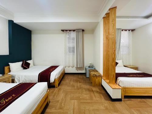 Giường trong phòng chung tại Dalat ECO Hotel 2