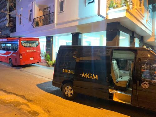 a black van parked in front of a building at Dalat ECO Hotel 2 in Da Lat