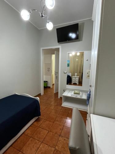 a room with a bed and a mirror in it at Le Stanze di Lucia vicino Ospedale Cardinale Panico a Tricase in Tricase
