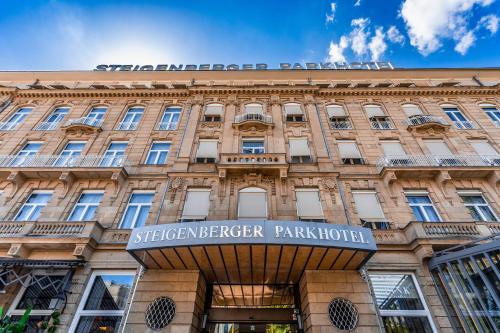 a building with a sign on the front of it at Steigenberger Icon Parkhotel Düsseldorf in Düsseldorf
