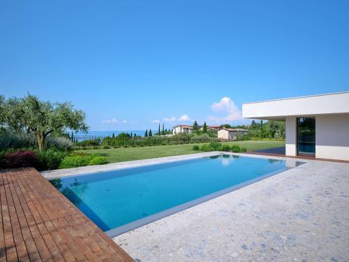 a swimming pool in the backyard of a house at ApartmentsGarda - Villa Bardolino in Garda
