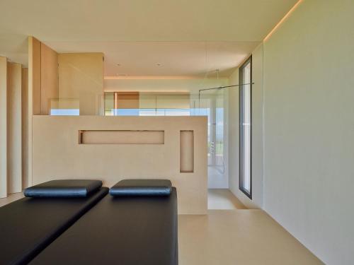 a modern house with black stools on the floor at VillasGarda - Villa Bardolino in Bardolino