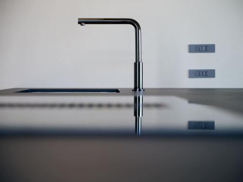 a close up of a table with a faucet at VillasGarda - Villa Bardolino in Bardolino
