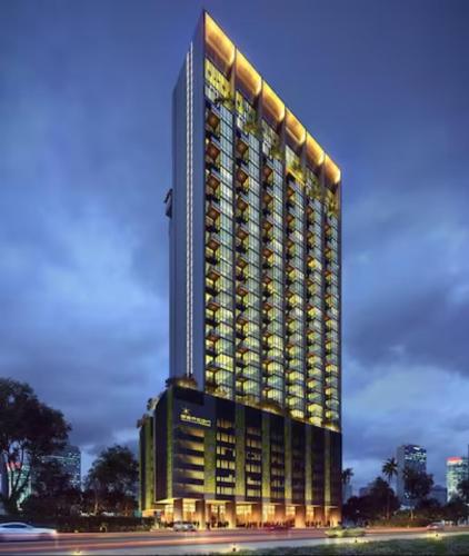 a rendering of a building with lights on it at Beacon Executive Suite by stayCATion Homestay in George Town