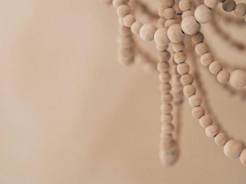 a row of beads hanging on a wall at Umdloti Boho Beach Villa in Umdloti