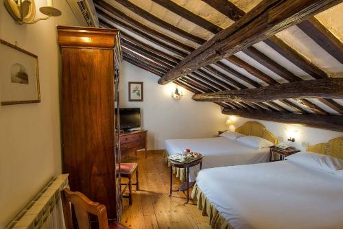 Postel nebo postele na pokoji v ubytování Hotel Fontana