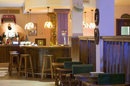 a bar in a restaurant with tables and chairs at The Sindbad in Hammamet