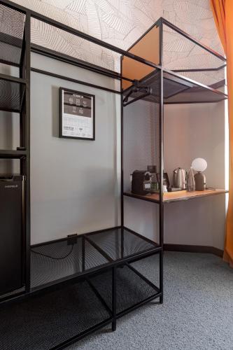 a bunk bed in a room with a shelf at Stay Swanky Bed & Breakfast in Zagreb