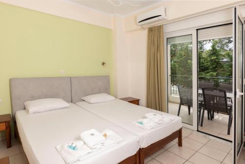Ένα ή περισσότερα κρεβάτια σε δωμάτιο στο Matthias Hotel Apartments