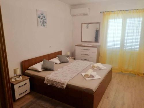 Postel nebo postele na pokoji v ubytování Apartments and rooms Krstina