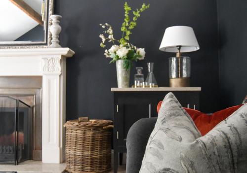 a living room with a couch and a fireplace at Luxury Croft Templepatrick Near Airport Rabbit and Hilton hotel in Templepatrick