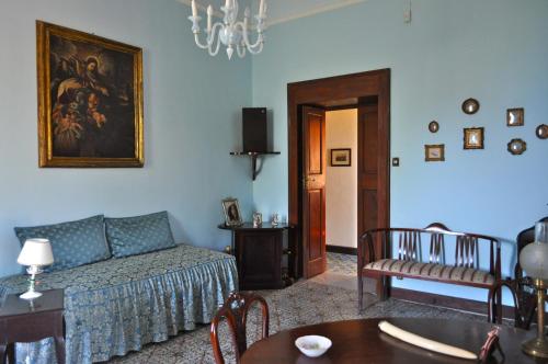 a living room with a couch and a table at Villa Elizabeth in Milazzo