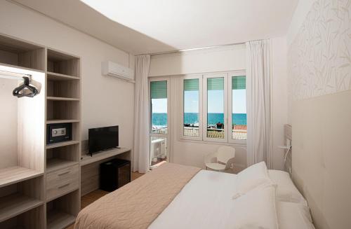 Postel nebo postele na pokoji v ubytování Hotel Splendid