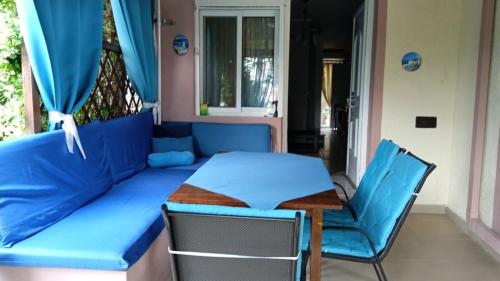 a room with a bed and a table and chairs at Nefeli Maisonette in Nikiti