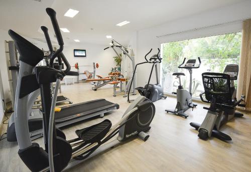 a gym with several exercise bikes and tread machines at The Sindbad in Hammamet