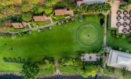 an overhead view of a yard with a golf course at Suan Sai Yok Resort in Sai Yok
