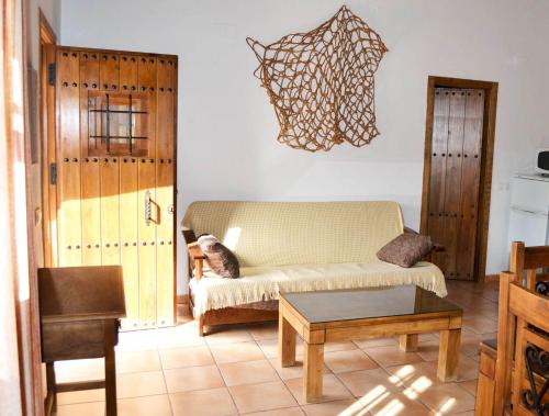 a living room with a couch and a table at Casa Rocío in Castril