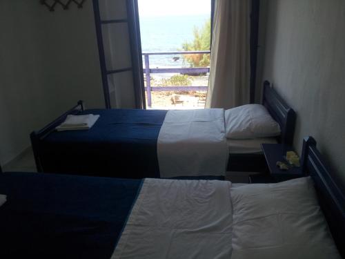 Postel nebo postele na pokoji v ubytování Georgoshouse Lykos beach Sfakia