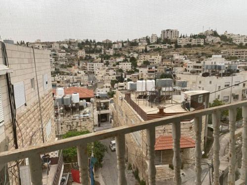 a view of a city from a balcony at Traditional Palestinian Home in Beit Sahour