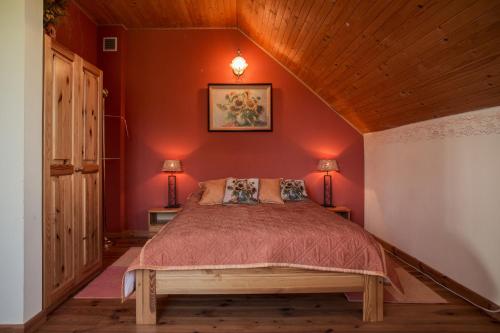 A bed or beds in a room at AZURIA agroturystyka