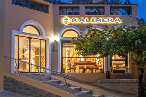 a store front of a building with a restaurant at Kalimera Andros in Andros