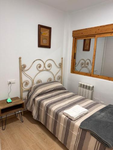 Postel nebo postele na pokoji v ubytování HOSTER EGYPT VERONA centro de Tomelloso