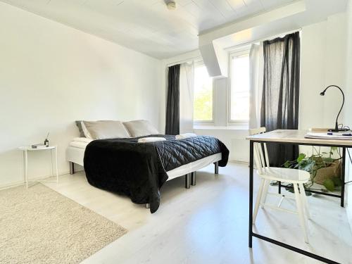 Postel nebo postele na pokoji v ubytování City Home Finland Downtown Suite- Perfect location & Great Amenities
