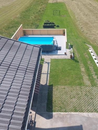 an overhead view of a swimming pool in a field at 2 studio & apartment Cvetek Bohinj in Bohinj