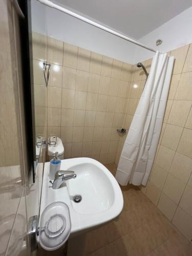 a bathroom with a sink and a shower at Hotel Milo Ksamil in Ksamil